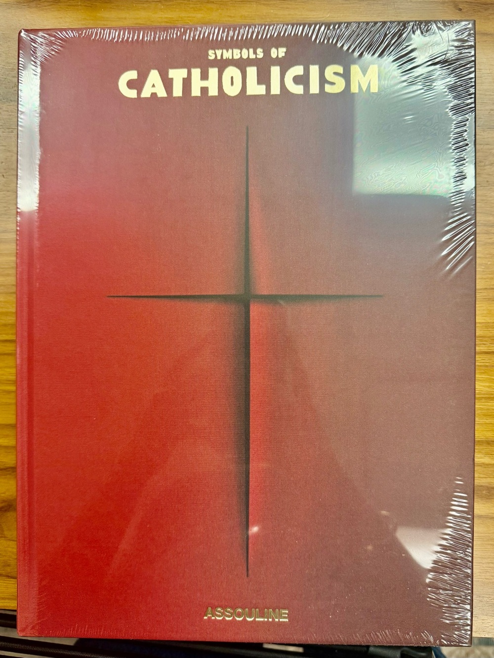 Assouline Red Hardcover coffee table book — Symbols of Catholicism